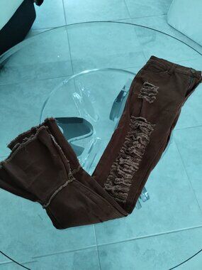 Distressed brown skinny jeans